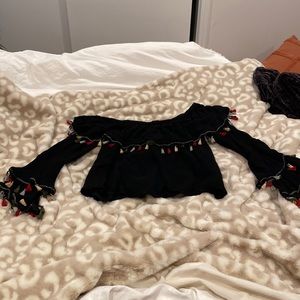 Altars state black off the shoulder tassel top! Size S